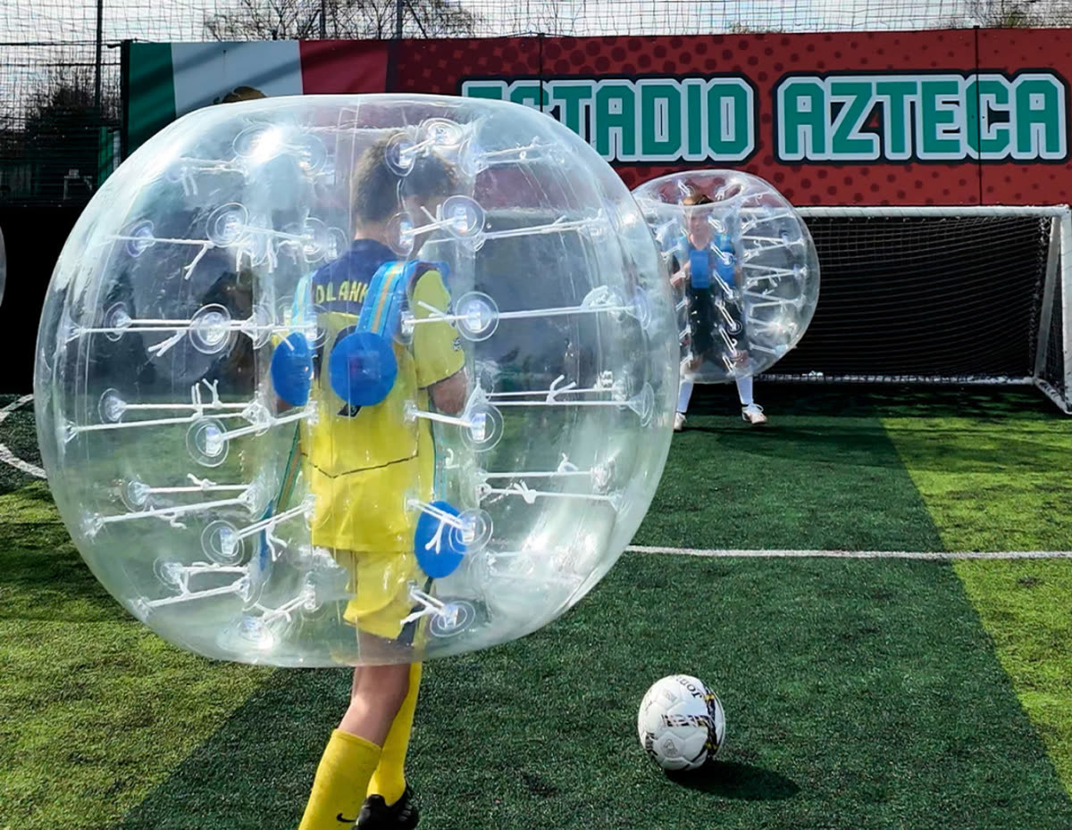 Kids playing bubble football at GOALS