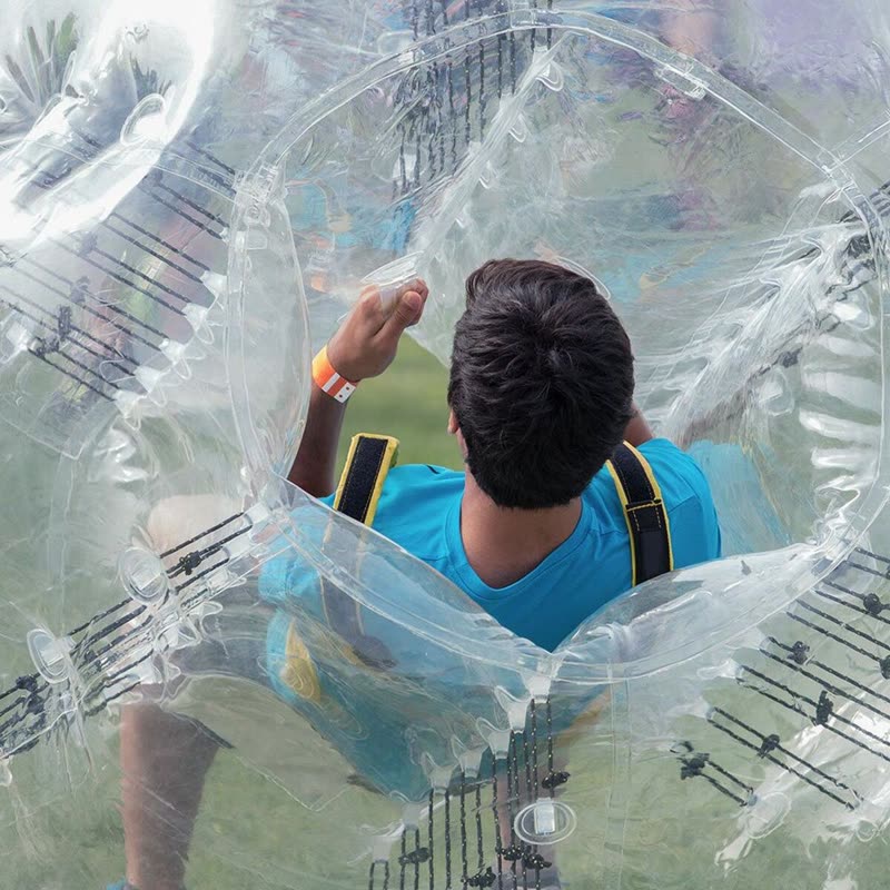An adult playing bubble football at GOALS